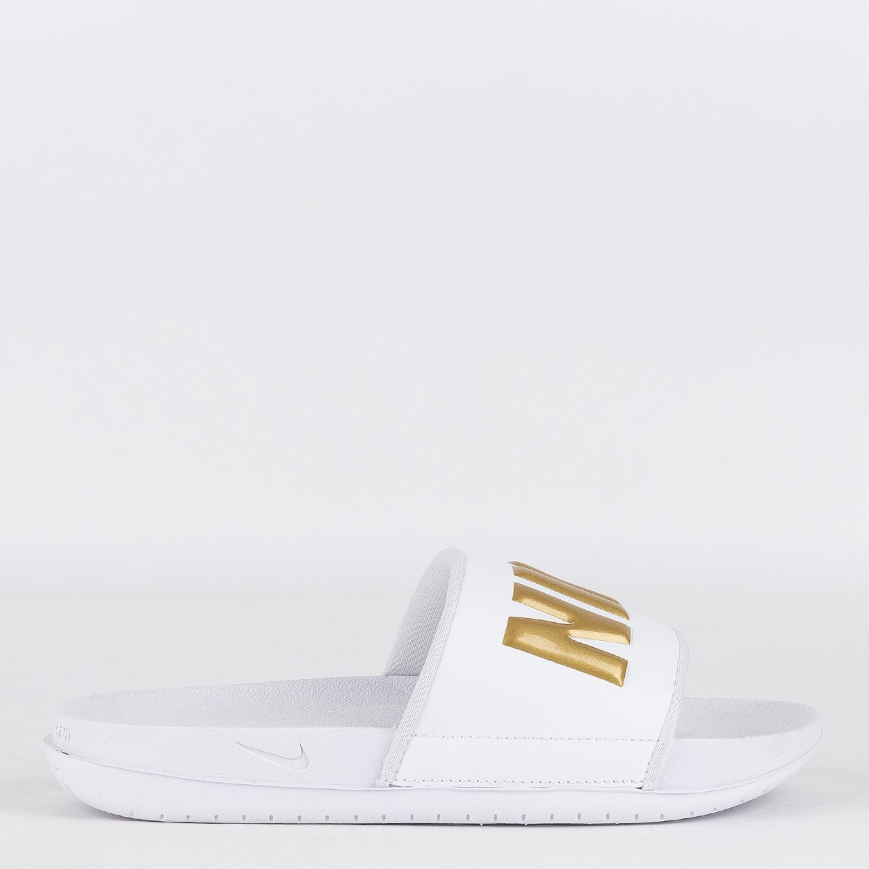 Nike hotsell slipper gold